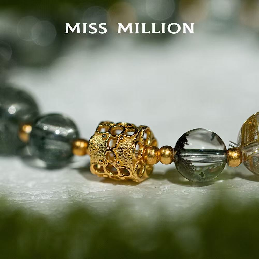 Golden rutilated quartz, which represents powerful life energy and has the auspicious meaning of attracting wealth and good fortune