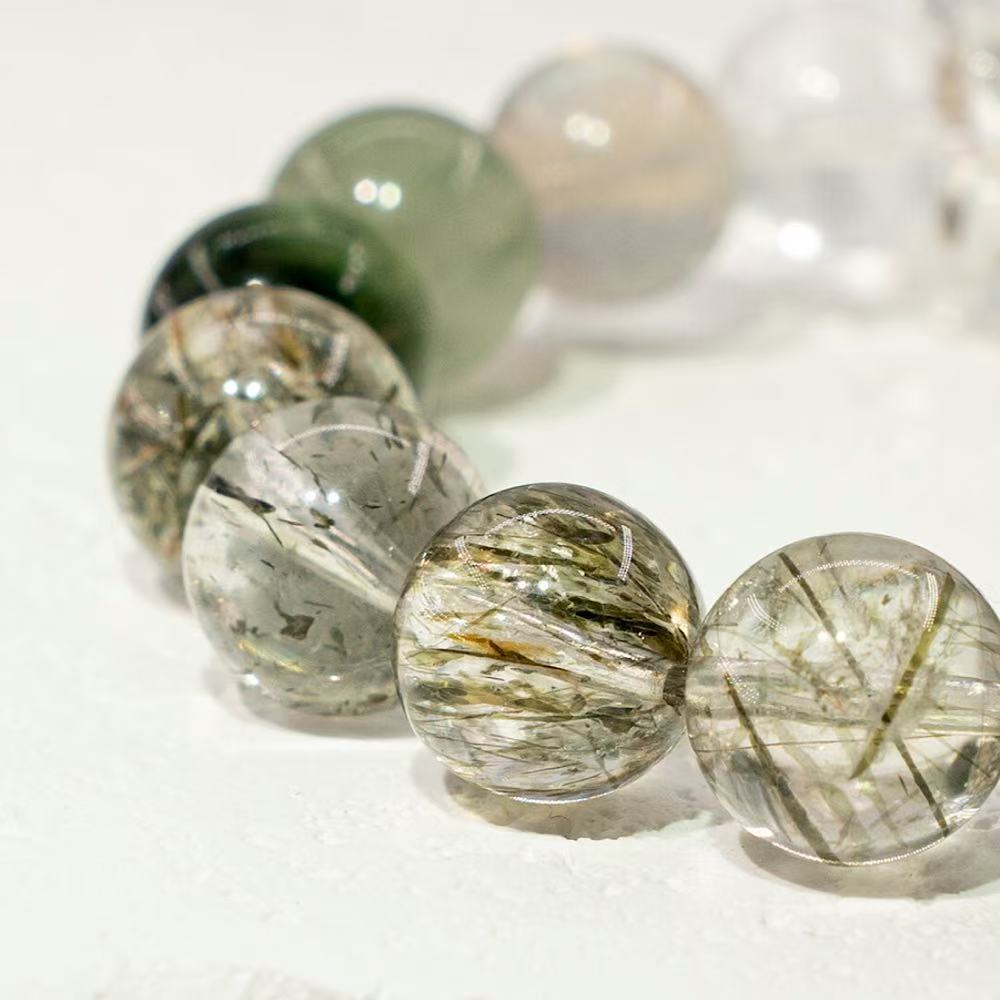 Yellow rutilated quartz shown here is known for attracting wealth and turning one's luck around
