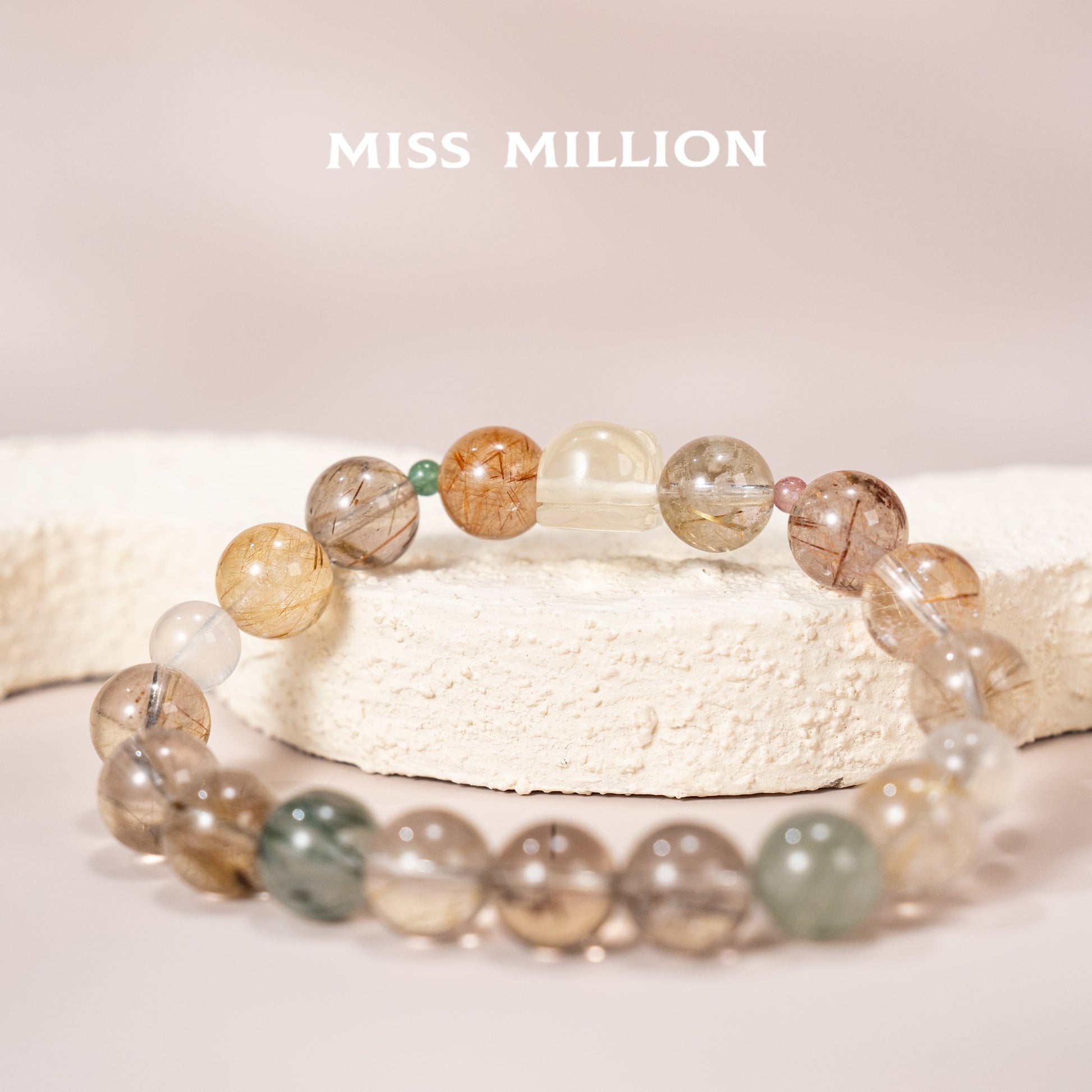 Discover a transformative crystal bracelet featuring rutilated quartz in various colors, citrine pixiu & blue moonstone. Enhance your well being&energy today