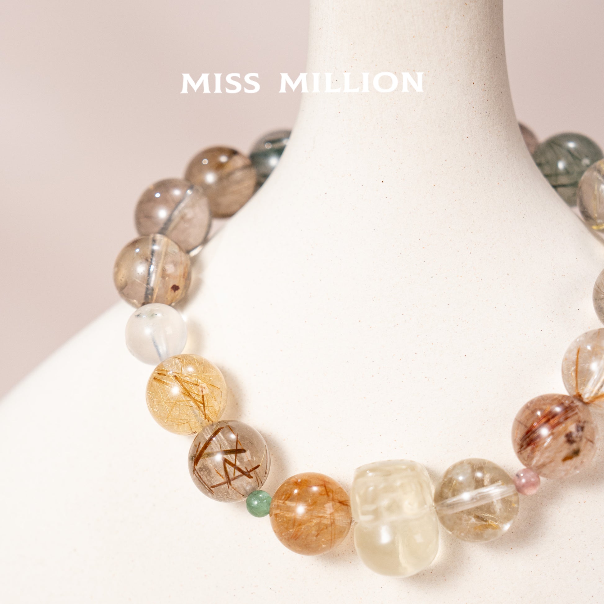 Discover a transformative crystal bracelet featuring rutilated quartz in various colors, citrine pixiu & blue moonstone. Enhance your well being&energy today