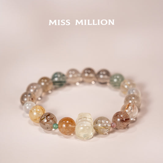 Discover a transformative crystal bracelet featuring rutilated quartz in various colors, citrine pixiu & blue moonstone. Enhance your well being&energy today